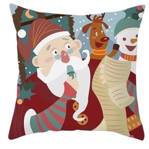 Close-up of Santa Claus, reindeer, and snowman cartoon patterns on festive cushion covers
