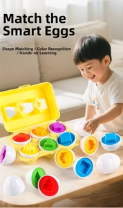 Close-up of a child matching colorful shapes inside realistic plastic eggs with egg tray
