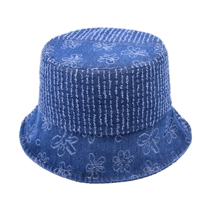 Classic blue denim bucket hat with white flower stitching and frayed stripe detail