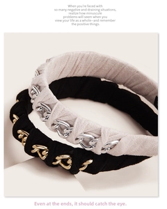 Macro detail of velvet headbands with metallic gold and silver thick chain intertwining