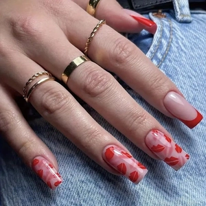 French tip press-on nails with red lip print and gold rings on denim background