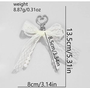 Pink lace bow keychain with pearls, showing dimensions 13.5cm and weight 8.87g