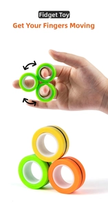 Close-up of colorful magnetic fidget rings in green, yellow, and orange for stress relief