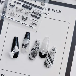 5D embossed nail art stickers with black butterfly designs and 3D bow decorations