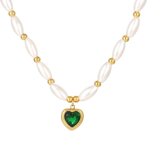 Vintage necklace with white faux pearls, gold beads, and a green heart crystal pendant