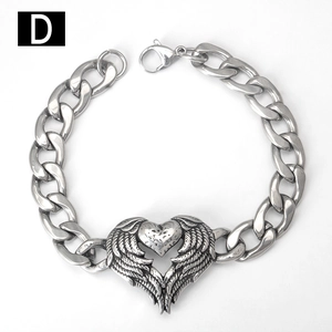 Detail of silver Cuban chain bracelet with heart wing pendant and lobster clasp
