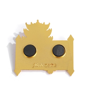 Detail view of the metallic Yellow Crane Tower fridge magnet showing dual rear magnets