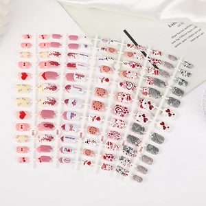 Short square press-on nails with red heart and rose designs for Valentine's Day