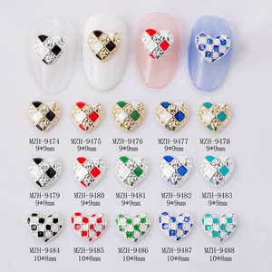 Detailed view of heart-shaped checkerboard nail charms with rhinestones in 9x9mm size