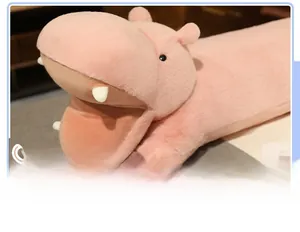 Close-up of pink hippo plush pillow featuring fine stitching and soft 3D facial details