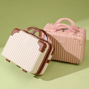 Mini 14-inch hard shell vanity cases in beige and pink for travel storage