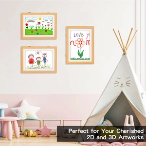 Three-piece wood frame set for 2D and 3D kids art displayed in a cozy nursery room