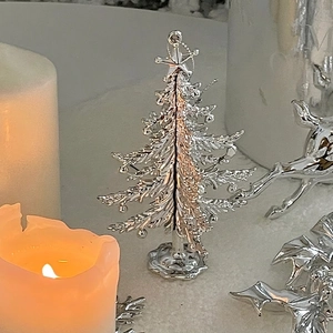 Elegant silver metallic Christmas tree desk ornament with star topper and festive deer