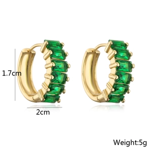 Detail of 18K gold plated hoop earrings featuring emerald green baguette zircon stones