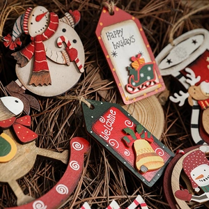 Rustic painted wooden Christmas tree ornaments with Santa and reindeer on wood slices