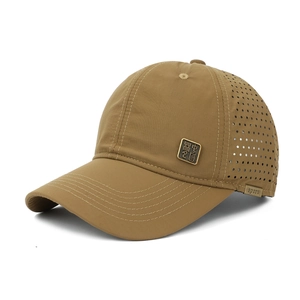 Detail of dark khaki baseball cap with perforated mesh sides and metal Chinese badge