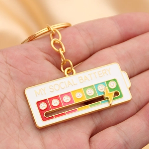Detail of My Social Battery interactive slider keychain with colorful enamel moods