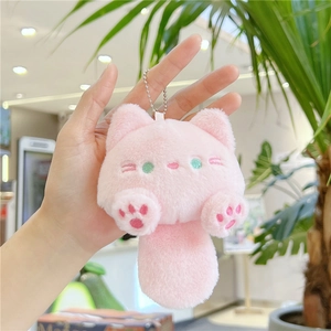 Detailed view of pink plush cat keychain featuring embroidered eyes and cute paw pads