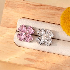 Pink and white clover stud earrings in silver steel on a premium display box
