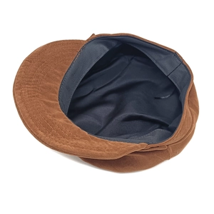 Classic brown suede newsboy cap featuring a vintage octagonal design and soft texture