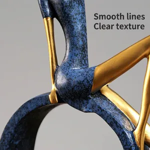 Modern abstract girl reading statue with blue marble texture and golden finish