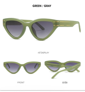 Detailed views of green cat-eye sunglasses with gray gradient lenses and gold temple accents