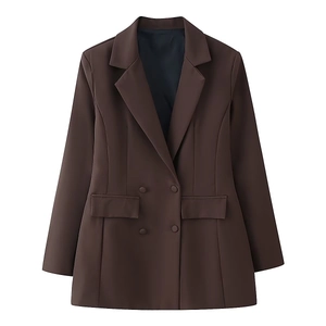 Detail of dark brown double-breasted blazer with classic peak lapel and flap pockets