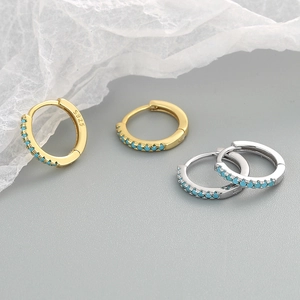 Gold and silver S925 sterling silver hoop earrings with turquoise stones in a boho style
