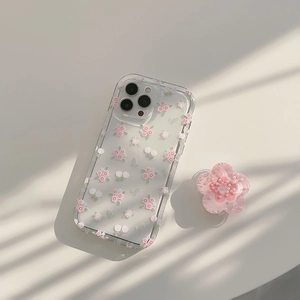 Detailed view of floral iPhone case with pink flower cherry patterns and pop-up stand