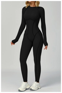 Close-up of black athletic catsuit featuring structured seams for a slim fit effect