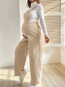 Fashionable maternity corduroy overalls in beige with elastic waist and loose fit