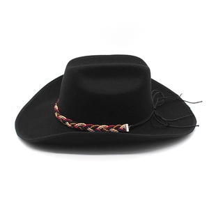 Detail of black wool felt cowboy hat featuring a colorful woven band and curled brim style