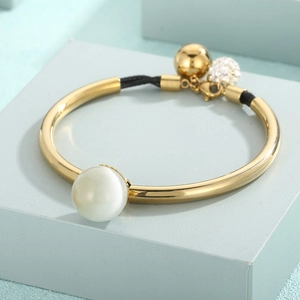 Gold titanium steel bead bracelet with white cat's eye stone and black cord detail
