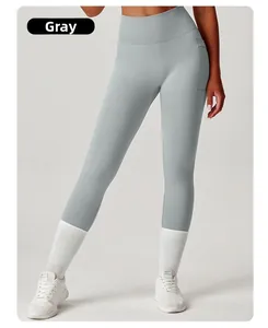 Detail view of high-waisted grey yoga leggings featuring functional side pockets for gym