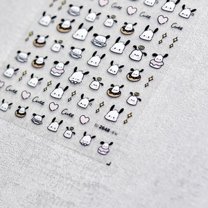 Detail of Pochacco nail stickers featuring cute cartoon dog patterns and hearts