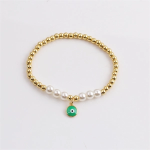 Bracelet à perles dorées avec perles blanches et pendentif œil grec vert pour femme