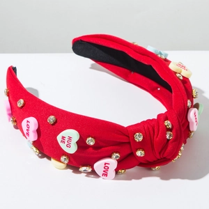 Detail of red knotted headband with LOVE candy hearts and sparkling rhinestones