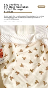 Detail of 3D textured dotted backing and cute bear pattern on a baby muslin blanket