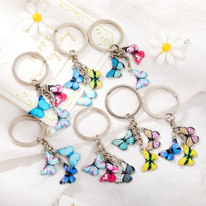 Set of 7 colorful enamel butterfly keychains with metal rings for bags and purses
