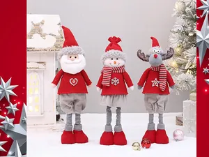 Three plush Christmas dolls including Santa Claus, snowman, and reindeer in knit sweaters