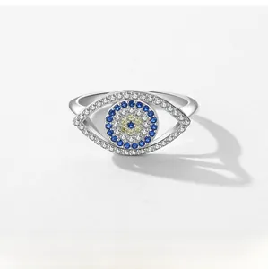 Close-up of S925 silver Evil Eye ring with pave zircon crystals and central blue stone