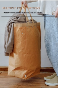 Detail of washable kraft paper storage bin with reinforced handles and rivet details