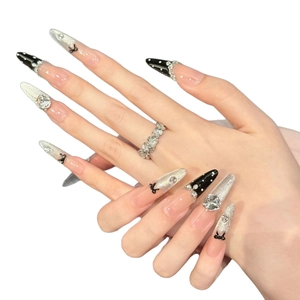 Pink and nude french bow press-on nails with glitter, dots and rhinestone charms
