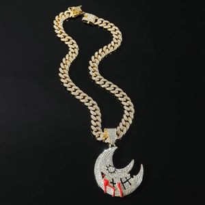 Hip hop moon pendant necklace in gold with diamonds and red enamel on cuban chain
