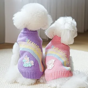 Detail of soft knit pet sweater featuring rainbow unicorn patch and elastic ribbed edges