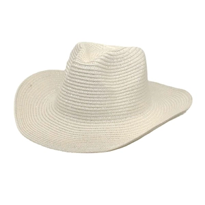 Detail of white woven straw cowboy hat with wide brim and classic fedora crown design