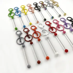 DIY beadable metal keychains in various colorful finishes on a clean white background