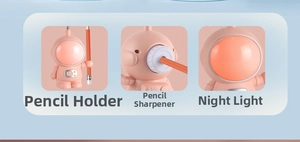 Pink astronaut desk lamp features built-in pencil sharpener, holder, and LED night light