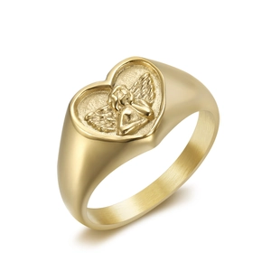 Minimalist gold heart signet ring with engraved angel relief and polished finish
