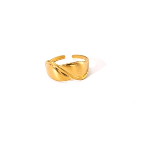 Detailed view of adjustable golden wide ring with fluid wavy texture and matte finish